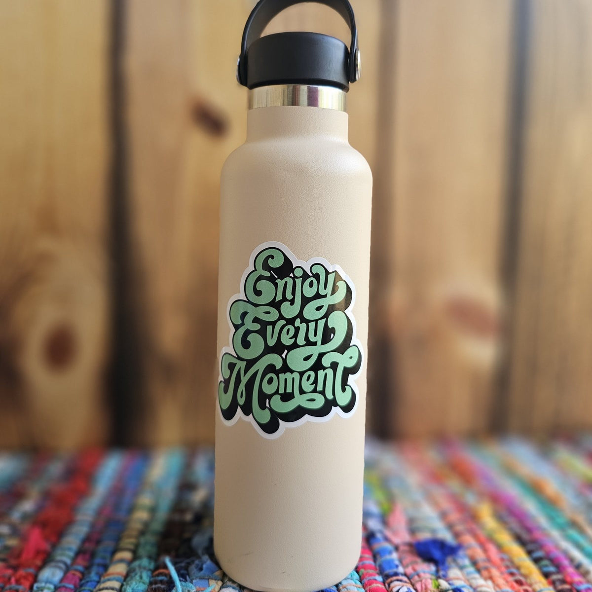 Enjoy Every Moment die cut sticker on a water bottle