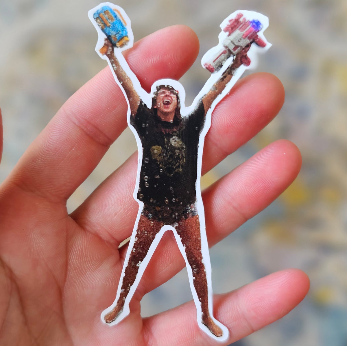 Custom die cut photo sticker held in an open hand